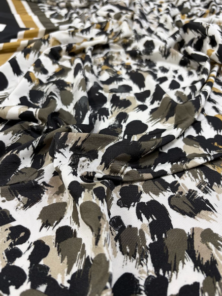 REF-199 ANIMAL-INSPIRED BORDER PRINT SLINKY VISCOSE JERSEY KNIT. ITALY. A CUT OF 1-1/2 YARDS